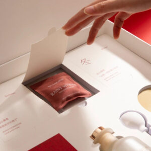 luxury red rigid gift box with blind box style compartments and insert for aromatherapy and candle gift packaging