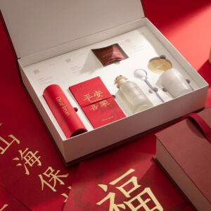 luxury red rigid gift box with blind box style compartments and insert for aromatherapy and candle gift packaging