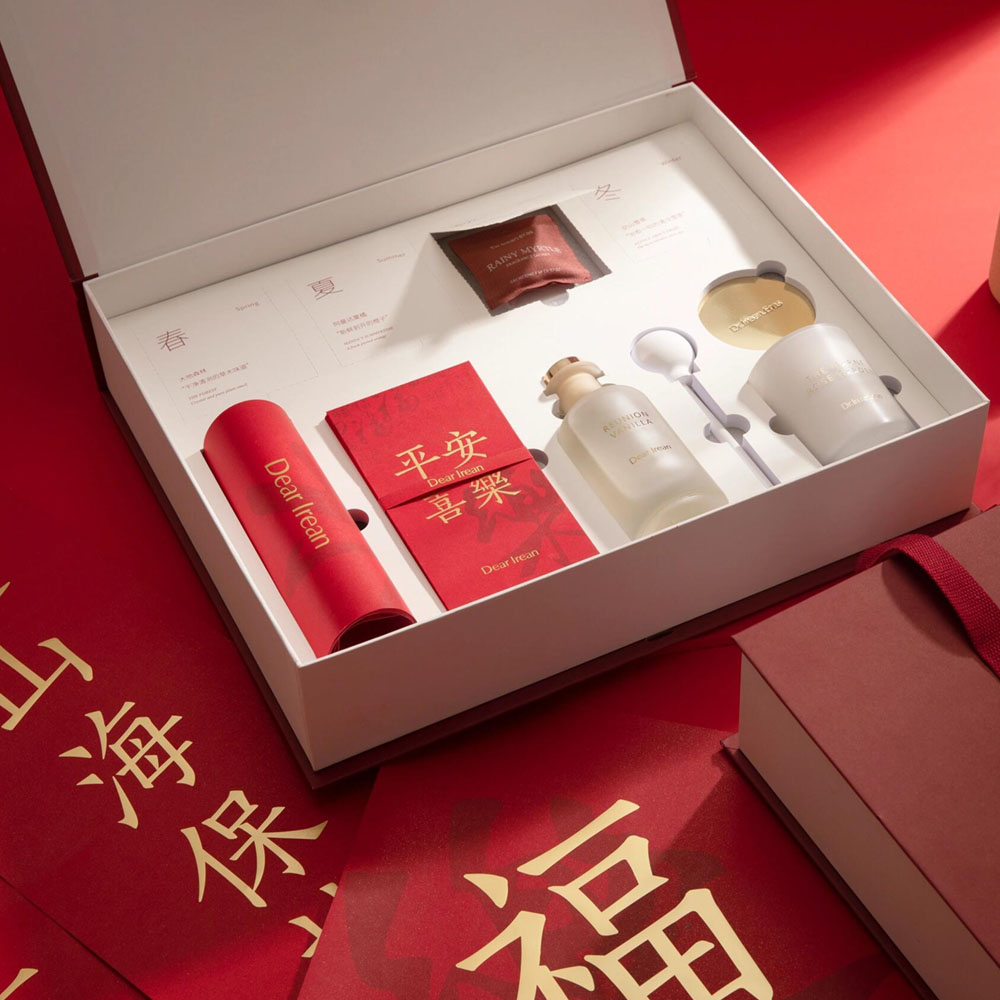 luxury red rigid gift box with blind box style compartments and insert for aromatherapy and candle gift packaging