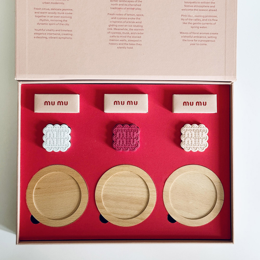 pink rigid paperboard gift box with flip lid and custom compartments for festive gift packaging