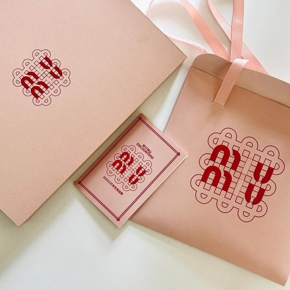 pink rigid paperboard gift box with flip lid and custom compartments for festive gift packaging