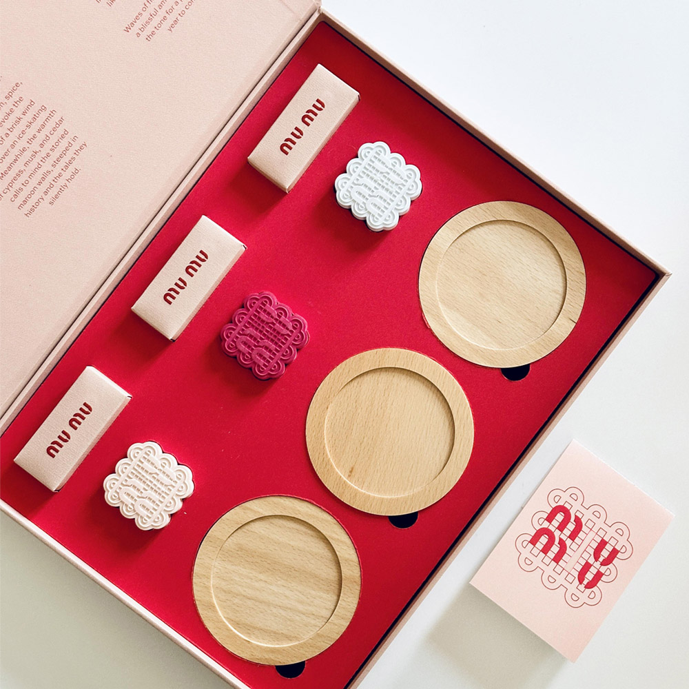 pink rigid paperboard gift box with flip lid and custom compartments for festive gift packaging