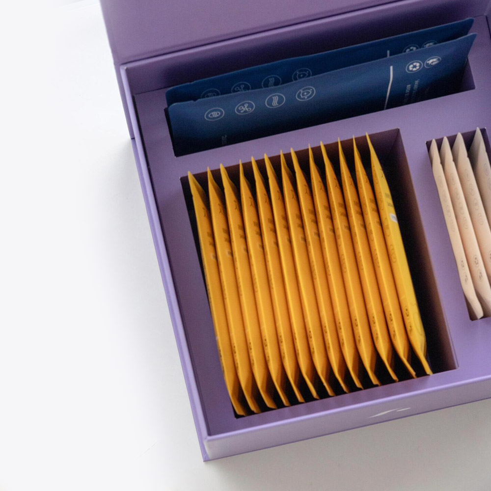 purple magnetic rigid gift box with flip lid and compartment insert for skincare mask and beauty gift packaging