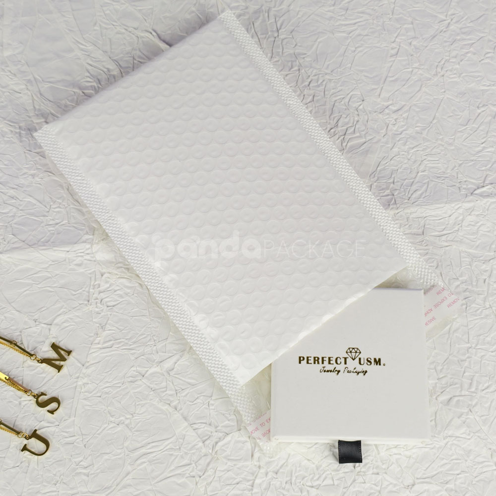 white bubble mailer bags with printed logo for jewelry, cosmetics and gift packaging