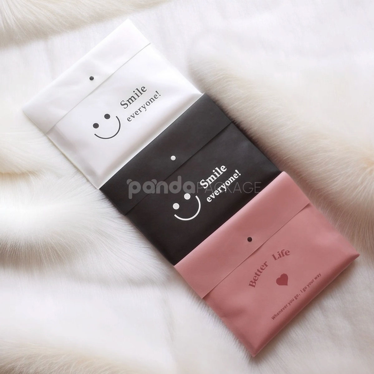 non-woven dustproof clothing packaging bags in black white and pink for apparel retail and storage