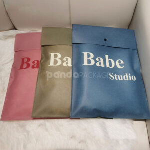 non-woven dustproof clothing packaging bags in black white and pink for apparel retail and storage