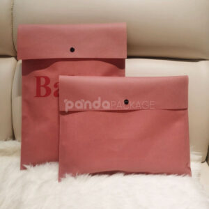 non-woven dustproof clothing packaging bags in black white and pink for apparel retail and storage