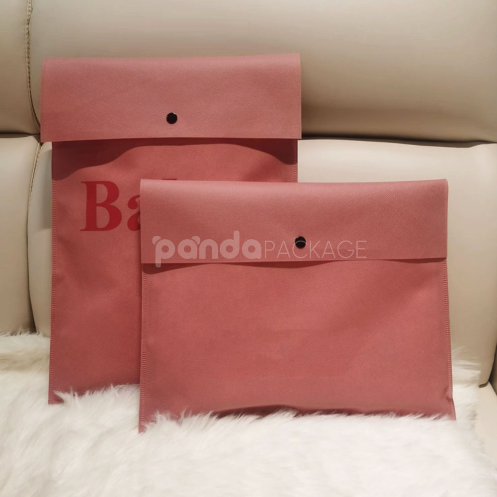 non-woven dustproof clothing packaging bags in black white and pink for apparel retail and storage