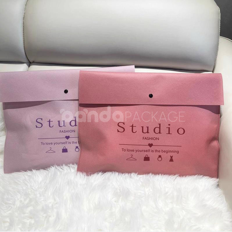 non-woven dustproof clothing packaging bags in black white and pink for apparel retail and storage