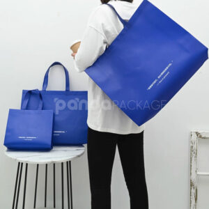 klein blue laminated non-woven tote bags with reinforced handles for apparel and retail packaging, customizable size and logo