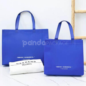 klein blue laminated non-woven tote bags with reinforced handles for apparel and retail packaging, customizable size and logo