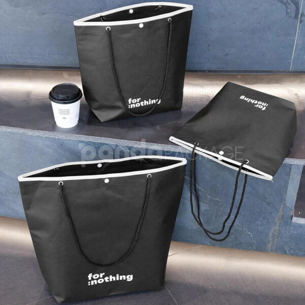 Tapered Non-Woven Tote Bags with Rope Handles and Piping Edges for Apparel Packaging