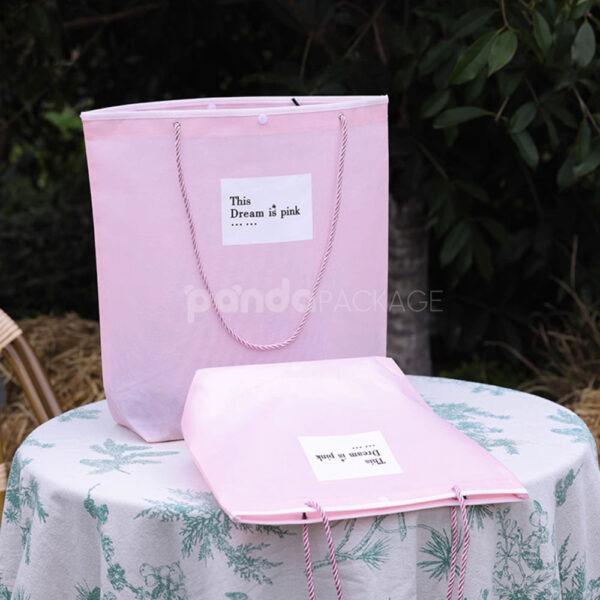 Tapered Non-Woven Tote Bags with Rope Handles and Piping Edges for Apparel Packaging