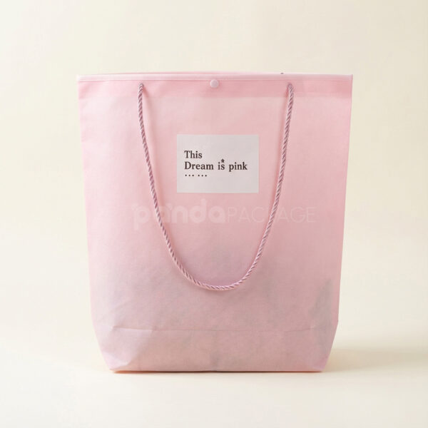 Tapered Non-Woven Tote Bags with Rope Handles and Piping Edges for Apparel Packaging