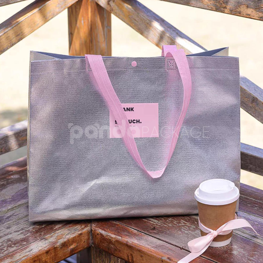 silver foil non-woven tote bags with fabric or plastic handles, customizable for apparel and gift packaging