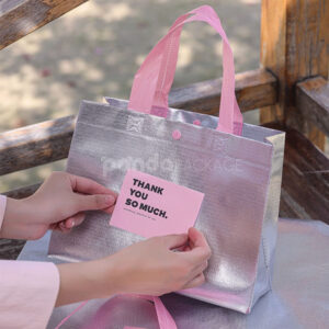 silver foil non-woven tote bags with fabric or plastic handles, customizable for apparel and gift packaging