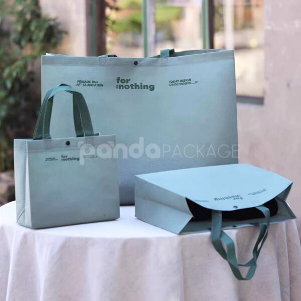 Thickened Non-Woven Tote Bags with Snap Button and Printed Designs for Apparel Packaging
