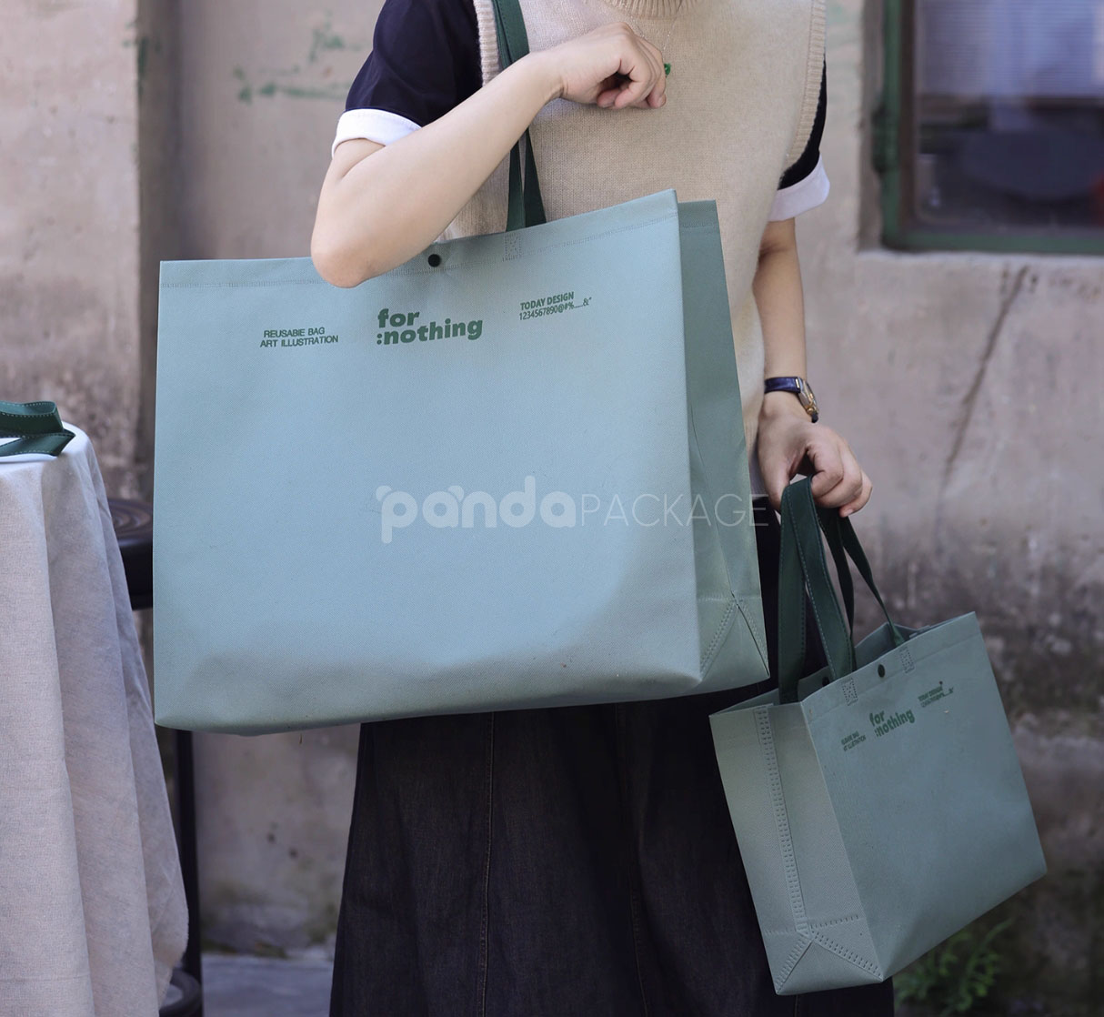 thickened non-woven tote bags with reinforced handles and snap button closure, custom printed for apparel and retail packaging