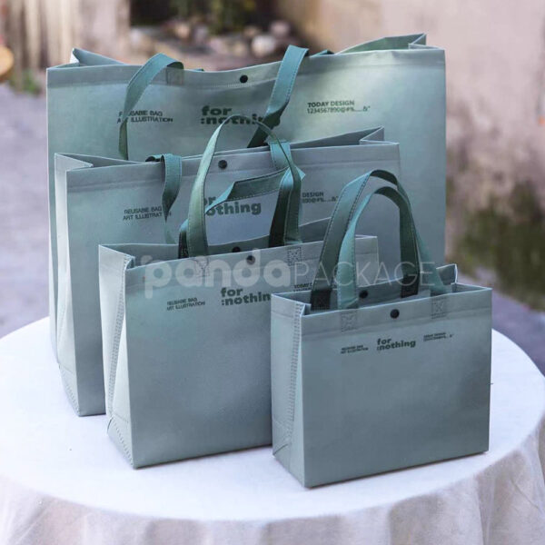 Thickened Non-Woven Tote Bags with Snap Button and Printed Designs for Apparel Packaging