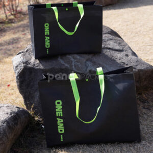 thickened non-woven tote bags with reinforced handles and snap button closure, custom printed for apparel and retail packaging