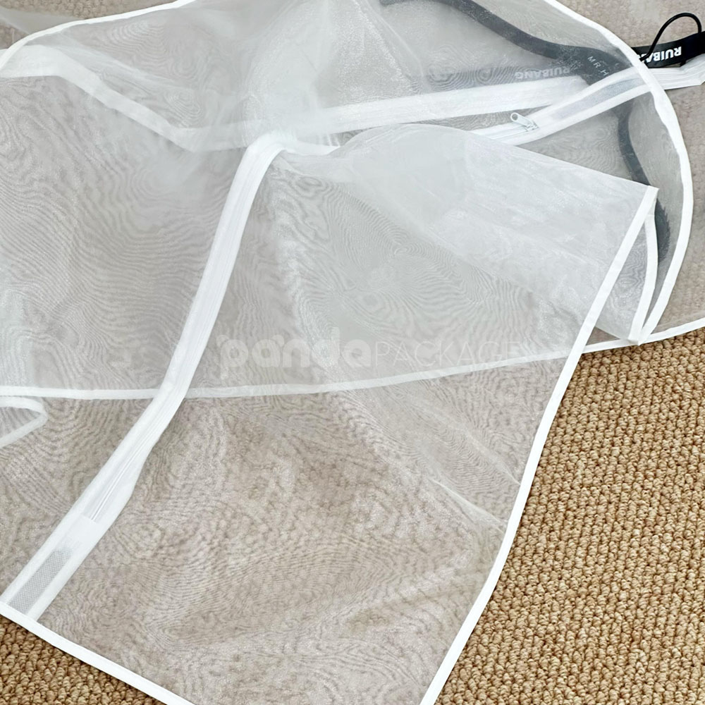white organza garment bags with full-length zipper for clothing storage and protection