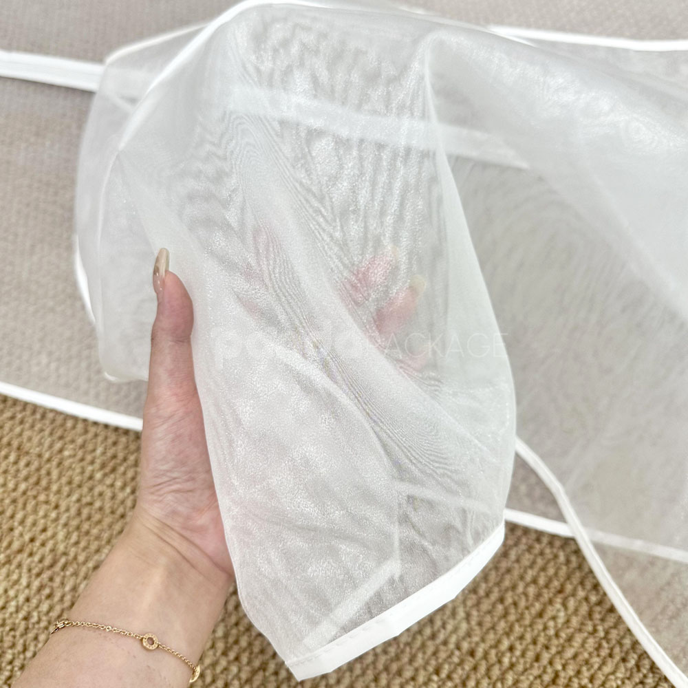 white organza garment bags with full-length zipper for clothing storage and protection