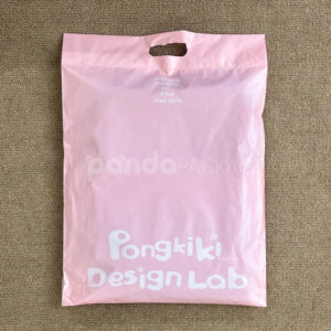 pink poly mailer bag with die-cut handle and self-adhesive closure for clothing packaging