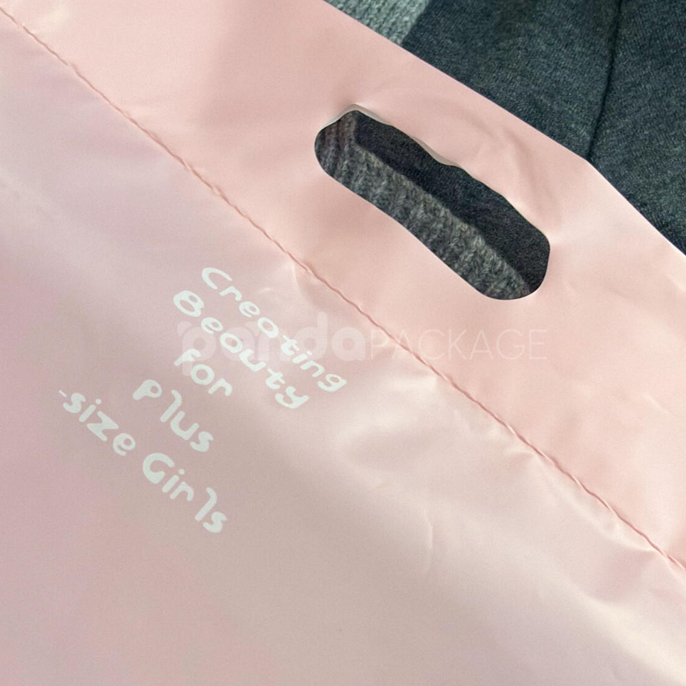 pink poly mailer bag with die-cut handle and self-adhesive closure for clothing packaging