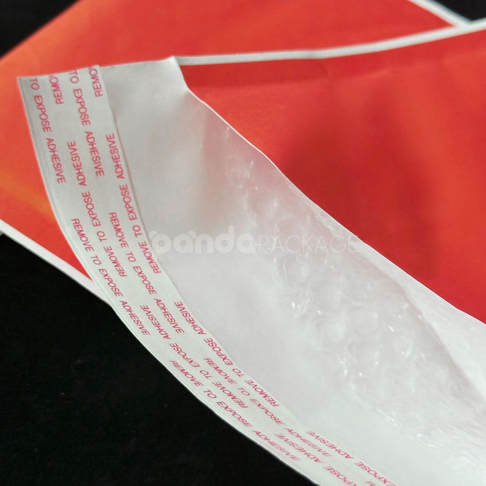 red kraft paper bubble mailer bag with self-adhesive closure for secure shipping