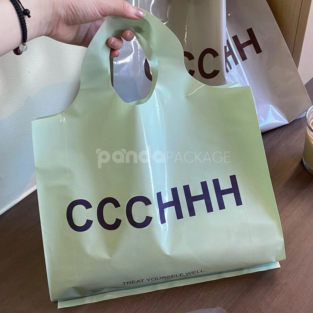 pastel color plastic shopping bag with round die-cut handle for clothing packaging