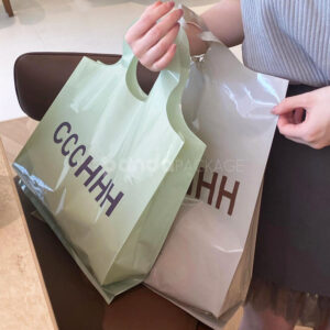 pastel color plastic shopping bag with round die-cut handle for clothing packaging