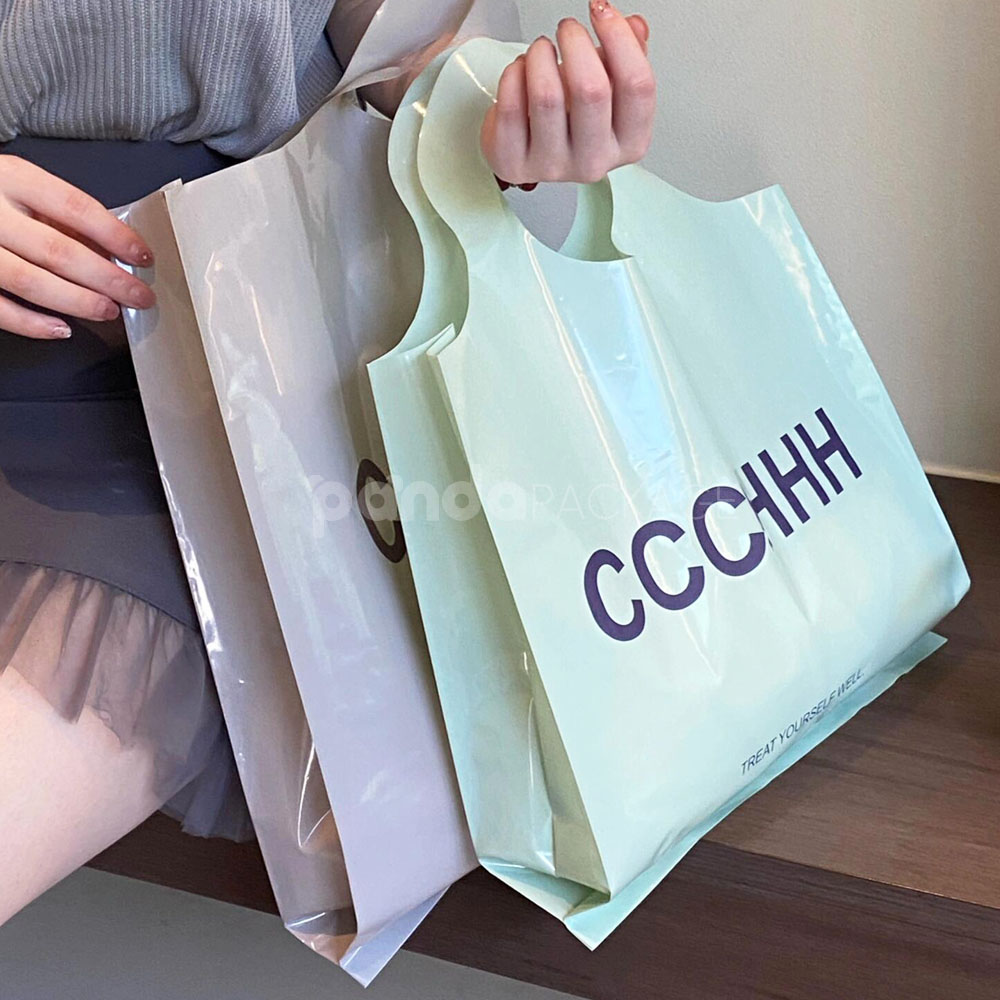 pastel color plastic shopping bag with round die-cut handle for clothing packaging