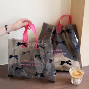 two-tone transparent plastic shopping bag with pink handles for clothing packaging