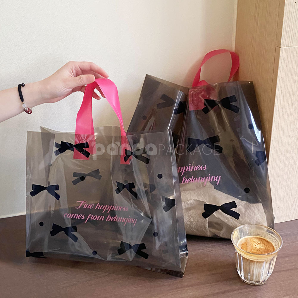 two-tone transparent plastic shopping bag with pink handles for clothing packaging