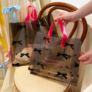 two-tone transparent plastic shopping bag with pink handles for clothing packaging