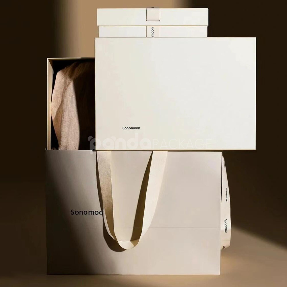 ivory rigid gift box with ribbon and matching paper bag for luxury product packaging