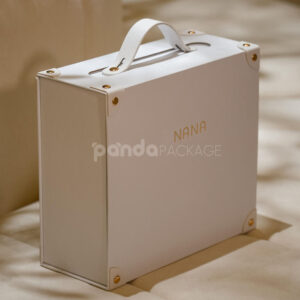white magnetic rigid box with handle and gold rivets for luxury gift packaging