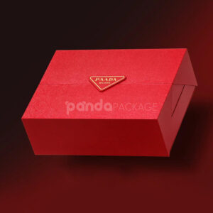 luxury magnetic flip lid rigid box with red textured surface and gold logo plaque for premium gift packaging