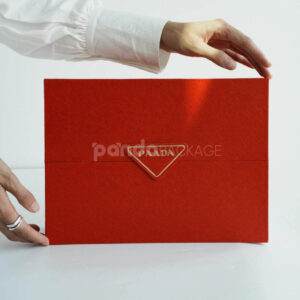 luxury magnetic flip lid rigid box with red textured surface and gold logo plaque for premium gift packaging