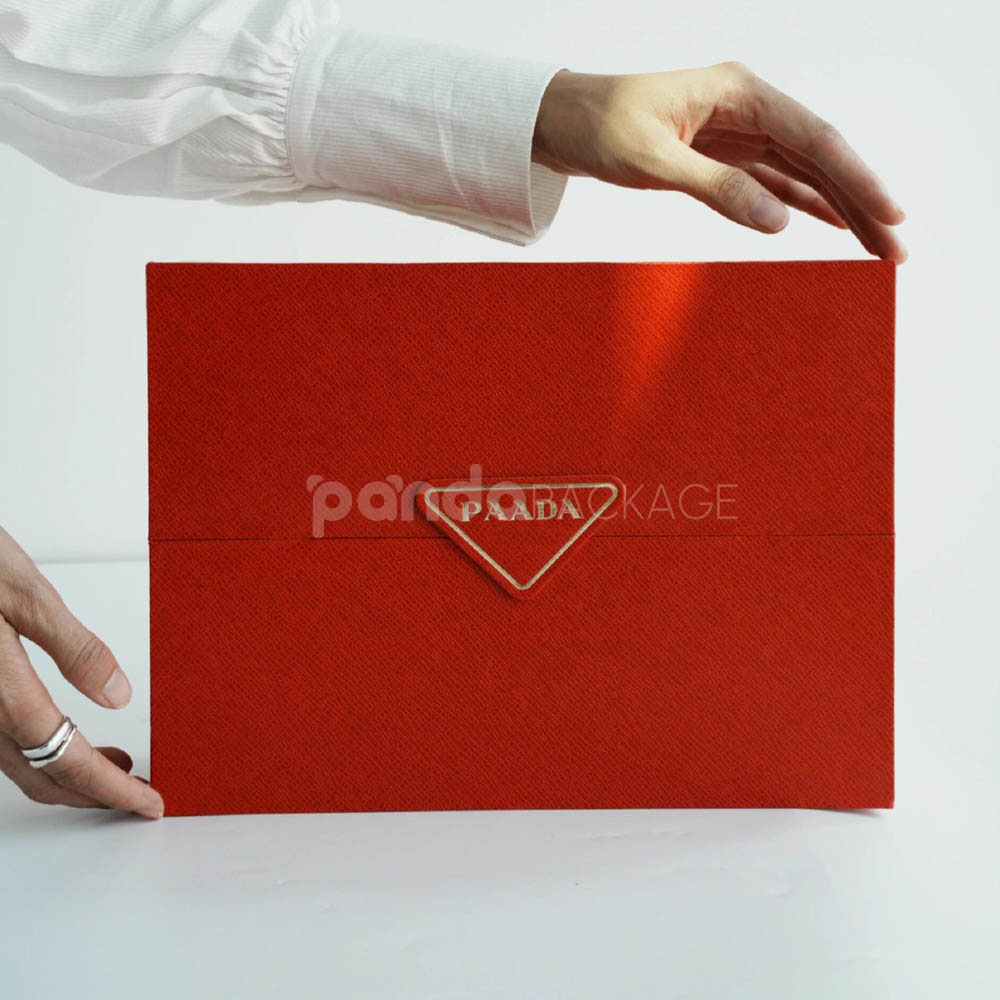 luxury magnetic flip lid rigid box with red textured surface and gold logo plaque for premium gift packaging