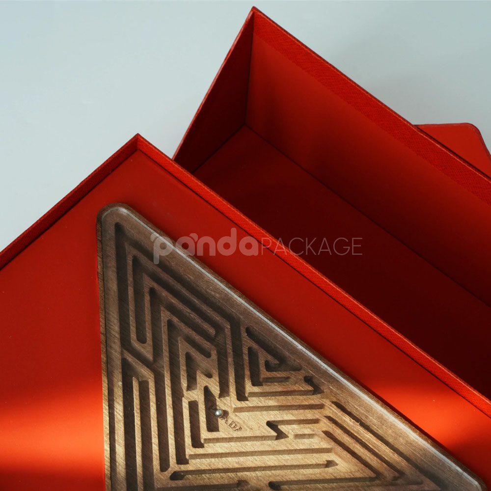 luxury magnetic flip lid rigid box with red textured surface and gold logo plaque for premium gift packaging