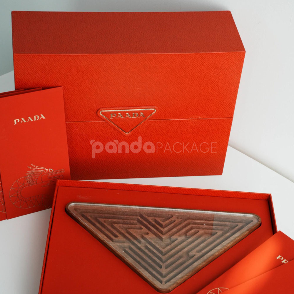 luxury magnetic flip lid rigid box with red textured surface and gold logo plaque for premium gift packaging