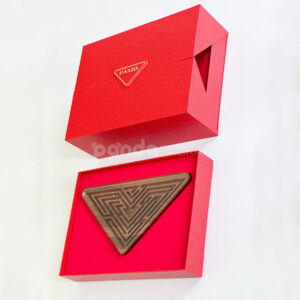 luxury magnetic flip lid rigid box with red textured surface and gold logo plaque for premium gift packaging