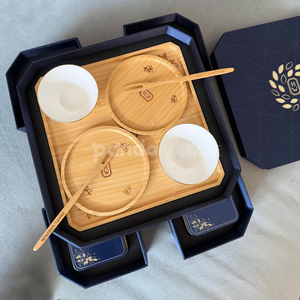 luxury octagonal rigid gift box in royal navy blue with gold foil logo, matching paper bag, and multi-drawer design for premium gifting
