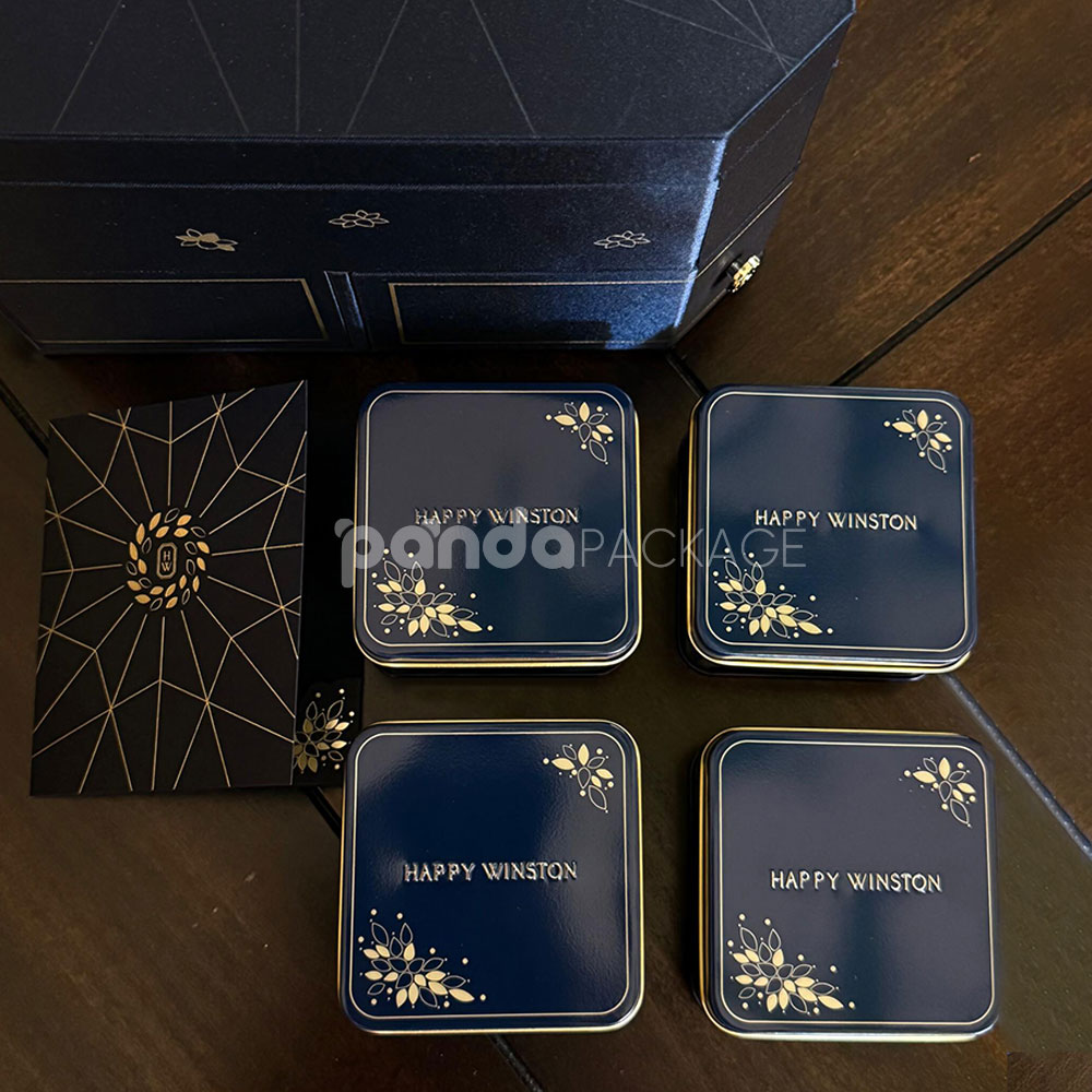 luxury octagonal rigid gift box in royal navy blue with gold foil logo, matching paper bag, and multi-drawer design for premium gifting
