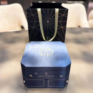 luxury octagonal rigid gift box in royal navy blue with gold foil logo, matching paper bag, and multi-drawer design for premium gifting