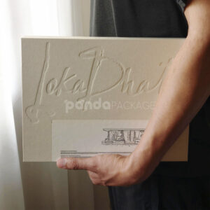 eco-friendly flip-top paperboard box for sustainable cosmetic packaging with blind box concept and embossed details