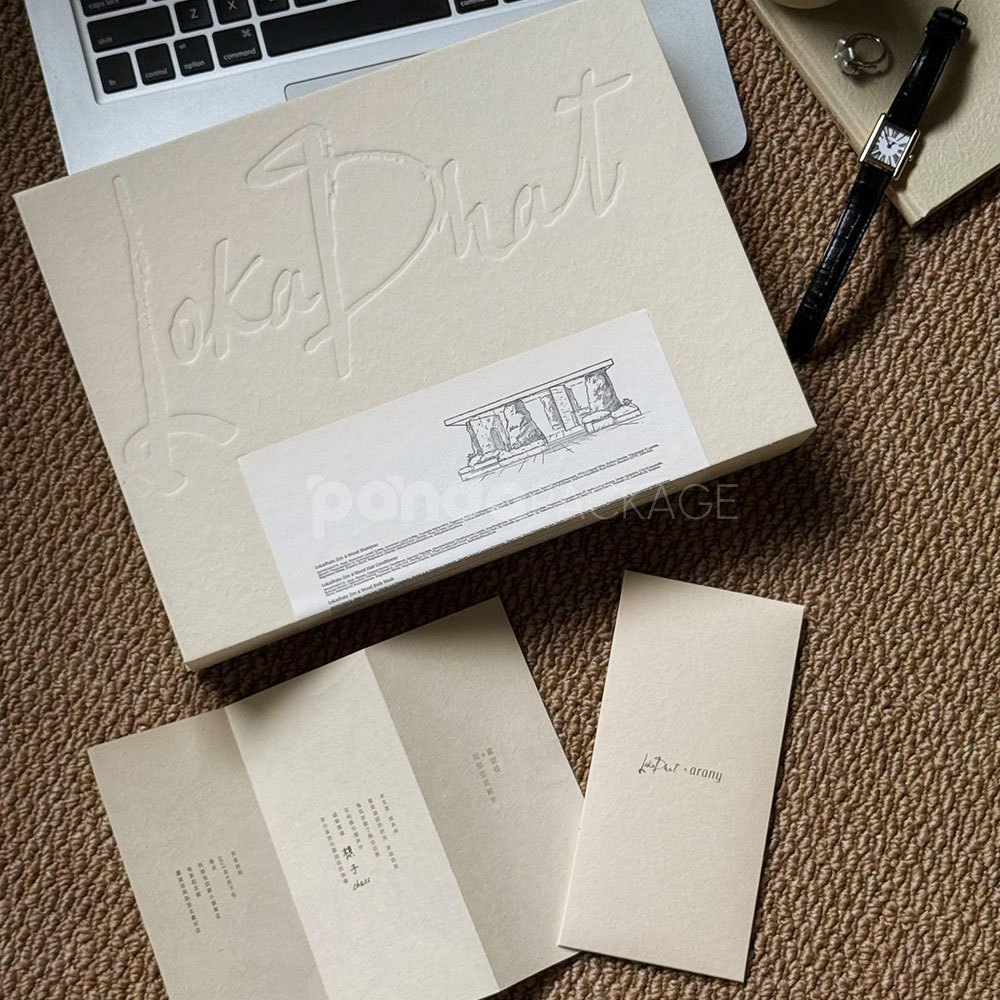 eco-friendly flip-top paperboard box for sustainable cosmetic packaging with blind box concept and embossed details