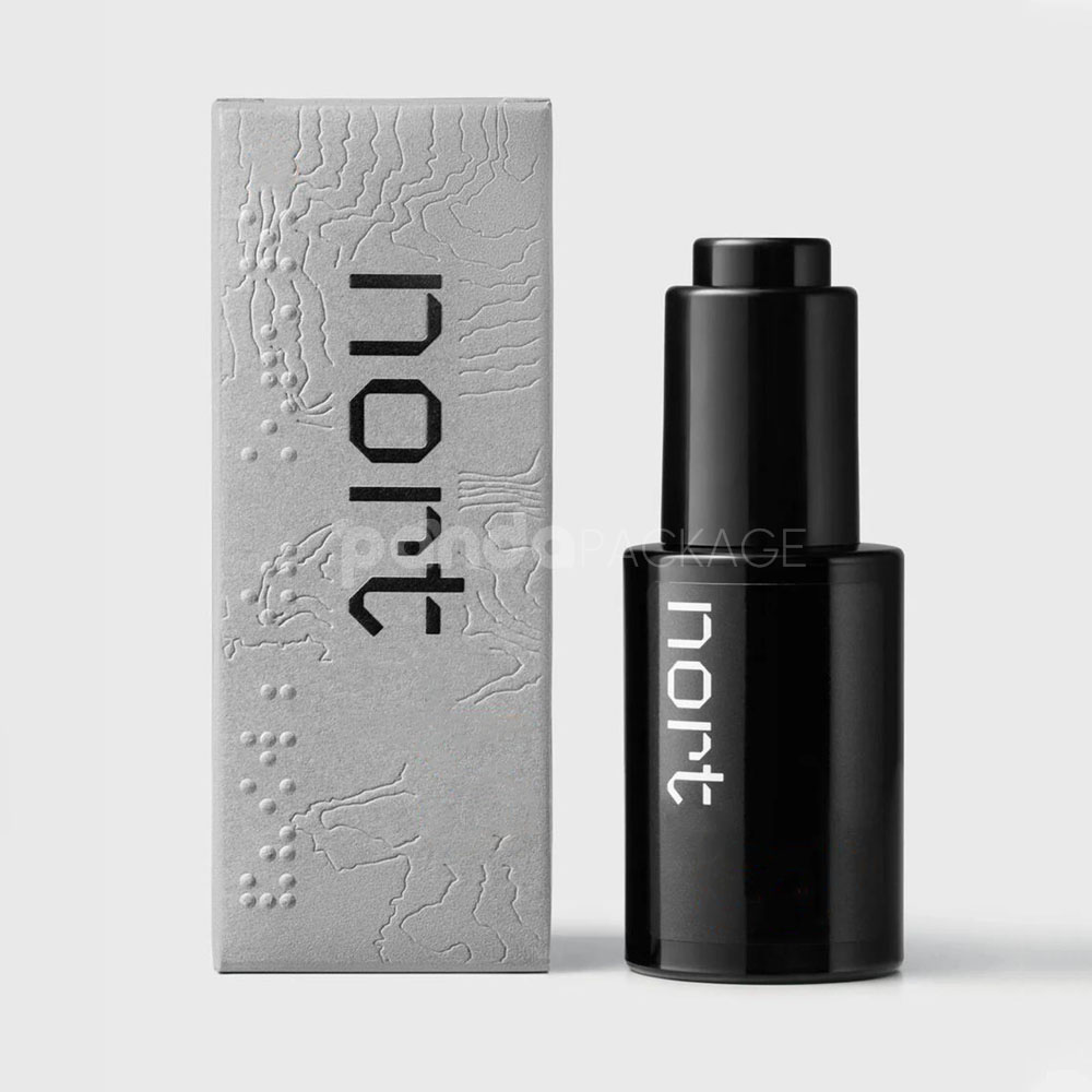 luxury textured grey paperboard box for skincare packaging with embossed terrain pattern and orange foil line details