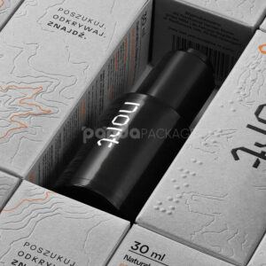 luxury textured grey paperboard box for skincare packaging with embossed terrain pattern and orange foil line details